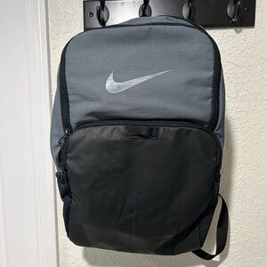 Nike gray and black backpack.  Has some wear on the front.